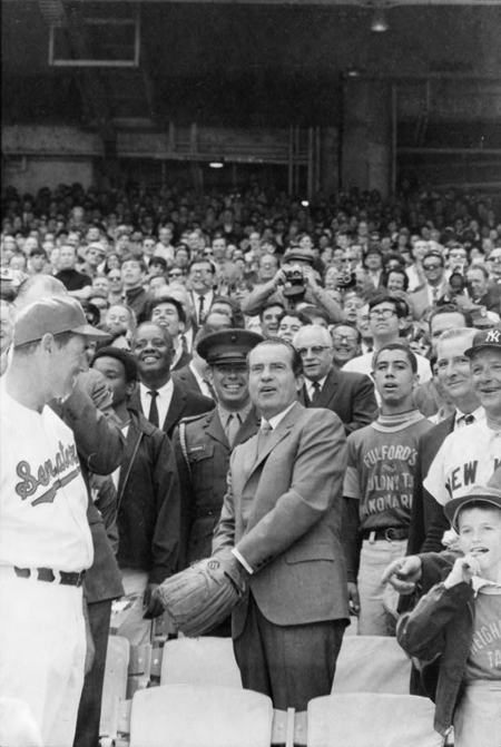 Pres. Richard Nixon tossing out baseball, at Senators' opening game with New York, Washington, D.C.