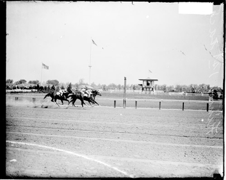 Kentucky Derby, racehorses racing to the finish line in the first race, held at Churchill Downs in Louisville, Kentucky