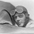 Charles Lindbergh, wearing helmet with goggles up, in open cockpit of airplane at Lambert Field, St. Louis, Missouri