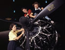 The careful hands of women are trained in precise aircraft engine installation
