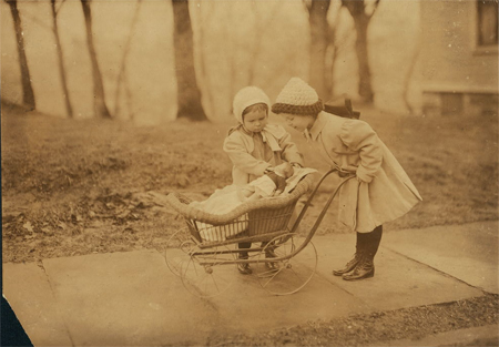 Children playing with Campbell kid dolls.