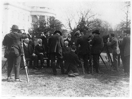 President Warren G. Harding and his cabinet posed on the White House Lawn, with photographers