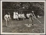 Socially prominent women and their daughters playing baseball
