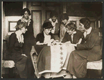 Alice Paul sews a star onto the NWP Ratification Flag