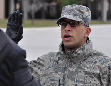U.S. Air Force Trainee Rachid Karame, 321st Training Squadron, takes his oath of citizenship at the basic military training retreat ceremony at Joint Base San Antonio – Lackland, Texas, Dec. 8, 2016. Trainee Karame became a citizen by joining the Air Force through the Naturalization at Basic Training Initiative. (U.S. Air Force photo by 1st Lieutenant Beau Downey)
