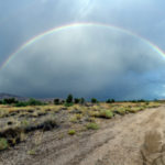 Double rainbow (the upper one is faint) over tiny Antares along historic U.S. Route 66 in Arizona