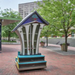 a large version of “little free libraries” — where passersby may leave or take a free book — in the courtyard of Triangle Park in downtown Lexington, Kentucky